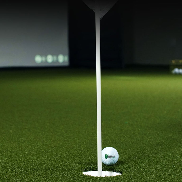 sigpro golf simulator flooring with putting cup and flag.